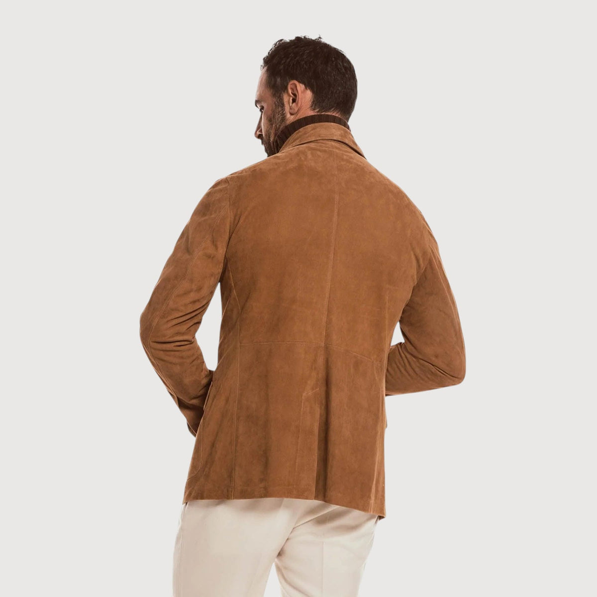 Luxequir Vogue handmade tan reverse suede safari jacket worn by a man, back view showing tailored fit and texture.