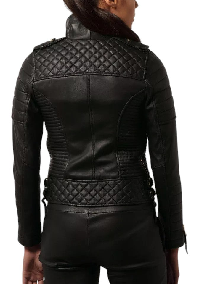 Front view of woman wearing a black quilted lambskin leather biker jacket with gold zippers and structured panels