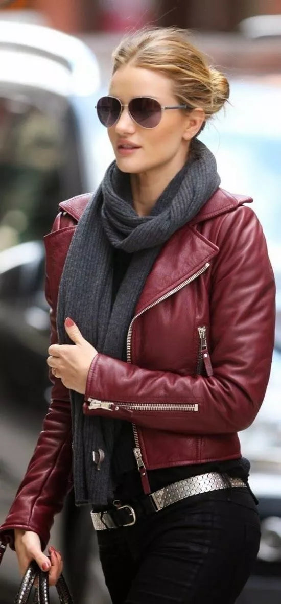 Front view of woman in burgundy lambskin leather moto jacket with scarf and sunglasses