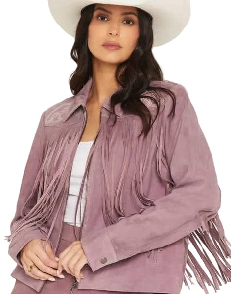 Woman wearing a mauve fringe jacket and white cowboy hat on a white background