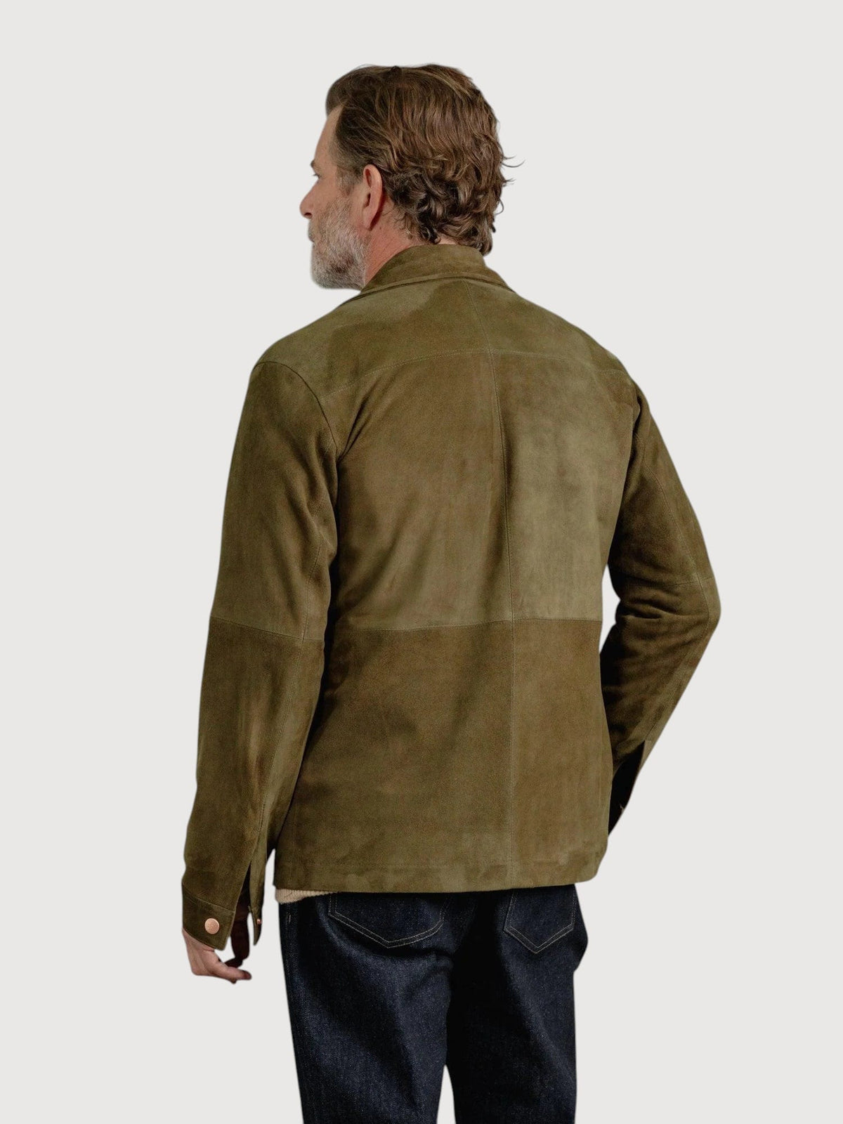 Luxequir Vogue moss green suede overshirt with panel detailing, shown from the back on a male model.