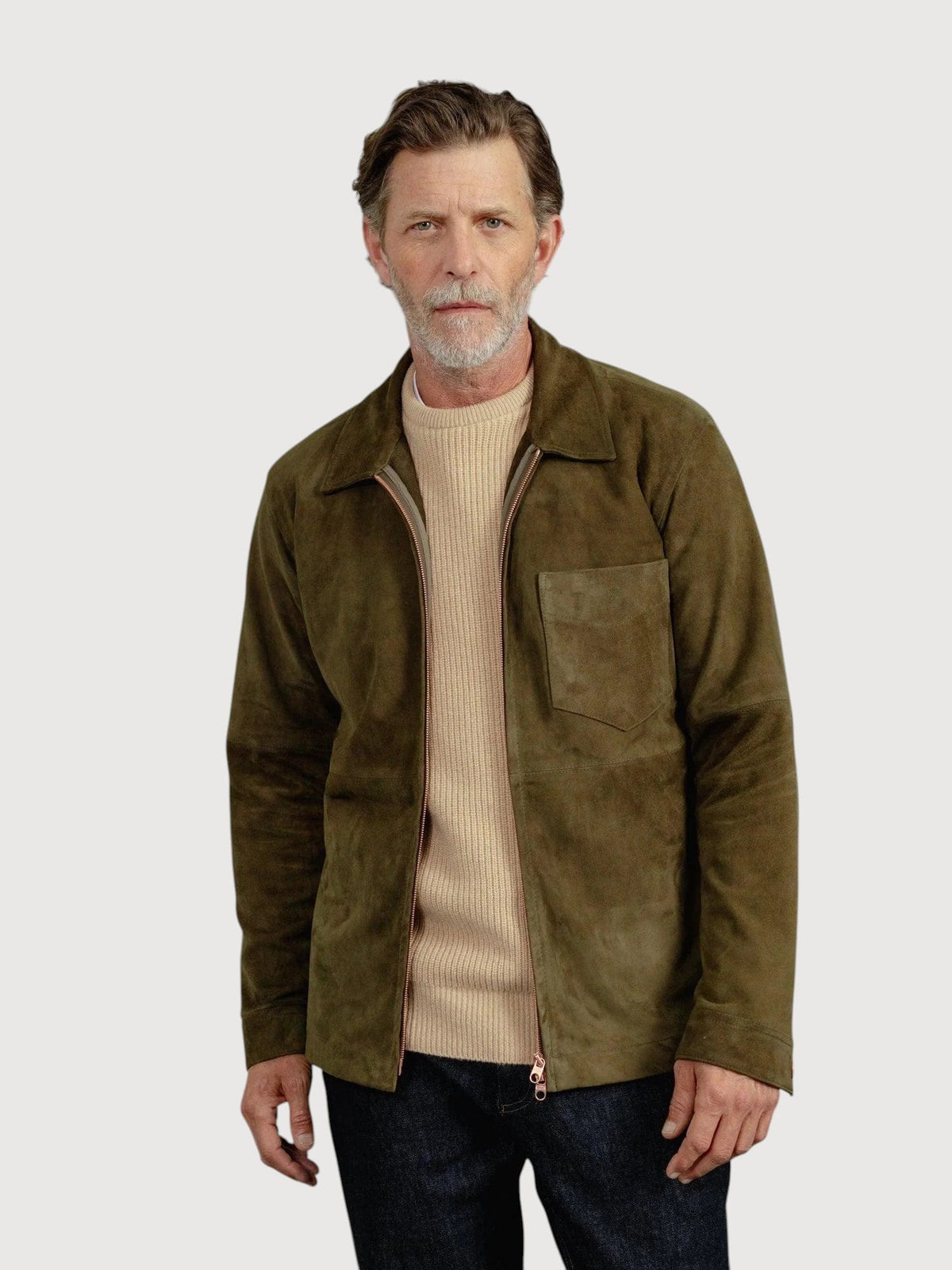 Luxequir Vogue moss green suede overshirt worn by a man over a beige sweater and dark jeans