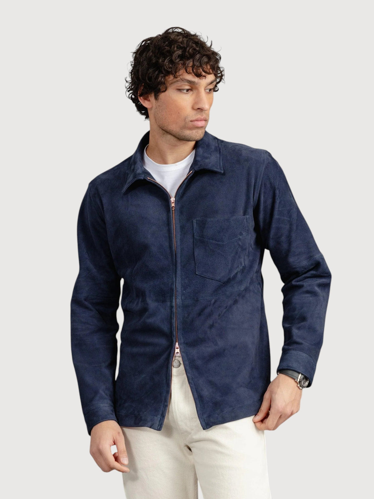 Luxequir Vogue navy blue suede panelled overshirt with a front zip closure worn by a man over a white t-shirt