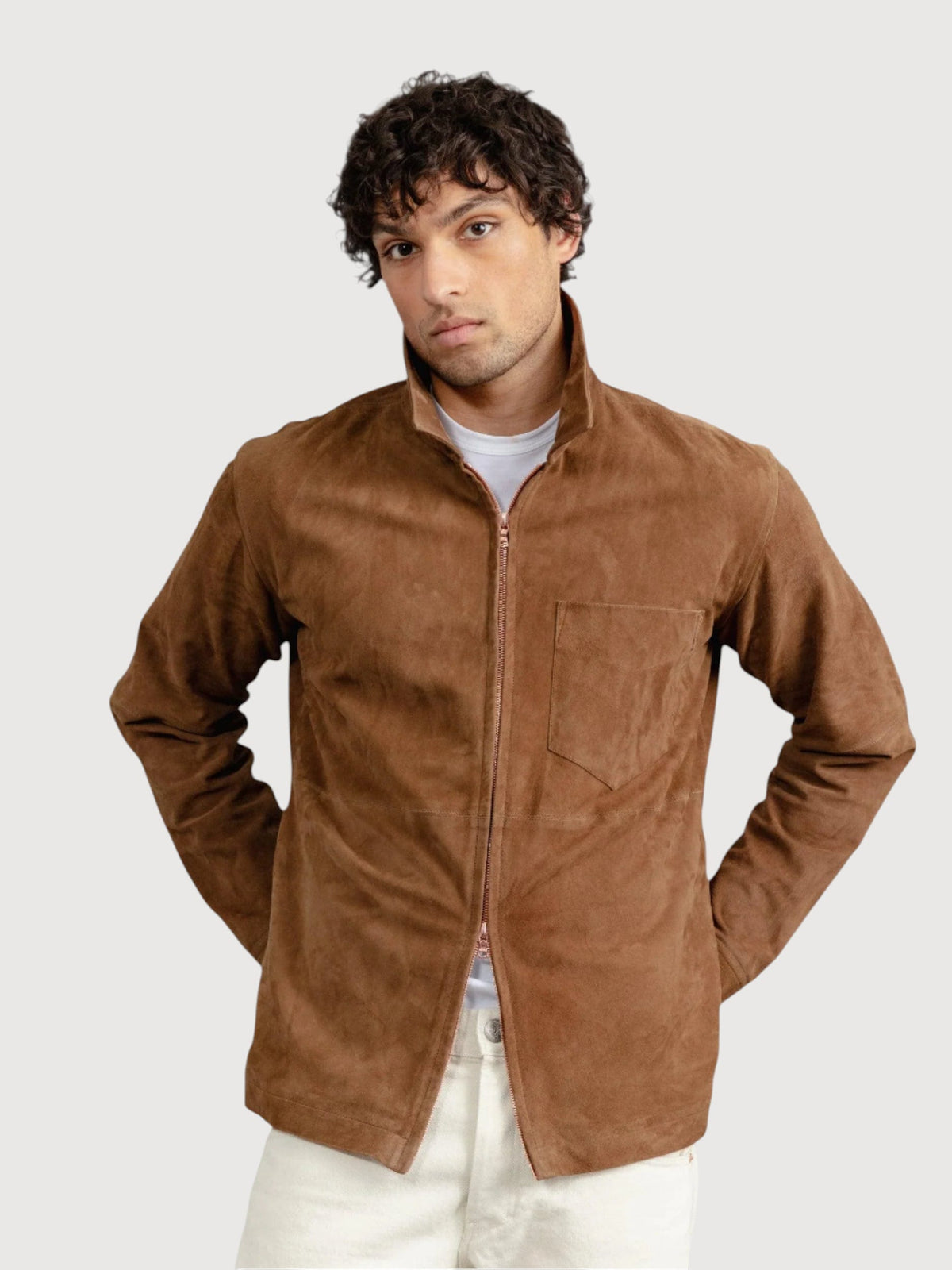 Luxequir Vogue tan suede panelled overshirt worn by a man with a white t-shirt and light trousers