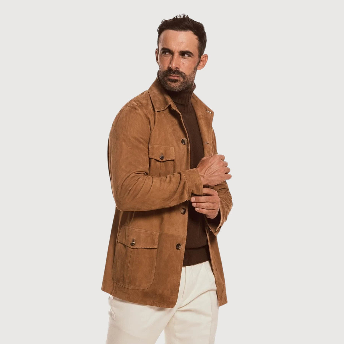 Luxequir Vogue handmade tan reverse suede safari jacket with four-pocket design and button closure on a male model.