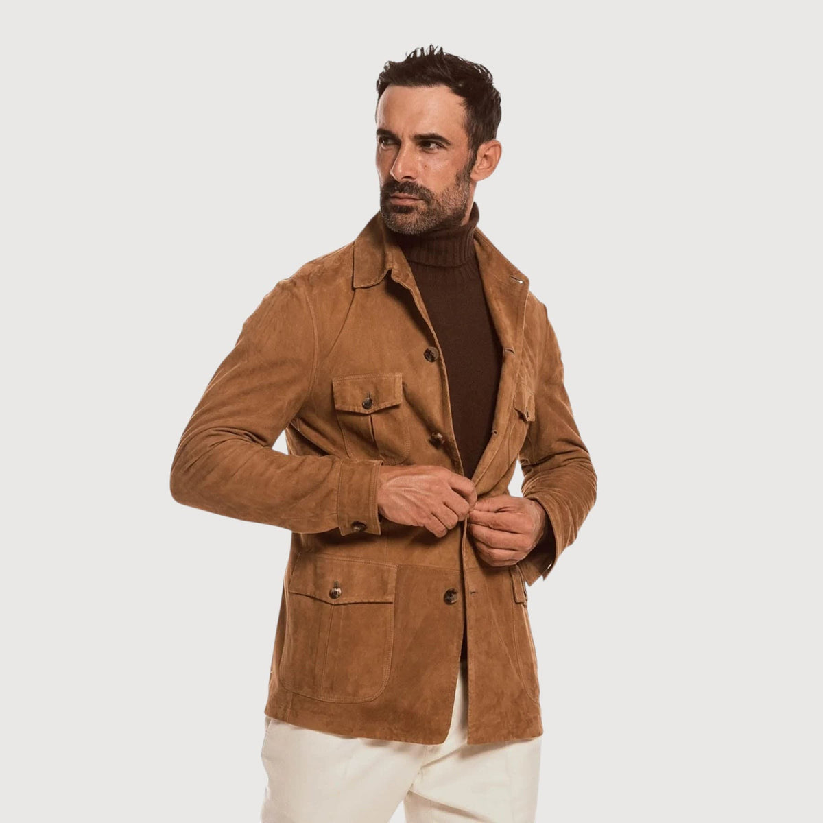 Luxequir Vogue handmade tan reverse suede safari jacket with four pockets and button closure worn by a male model